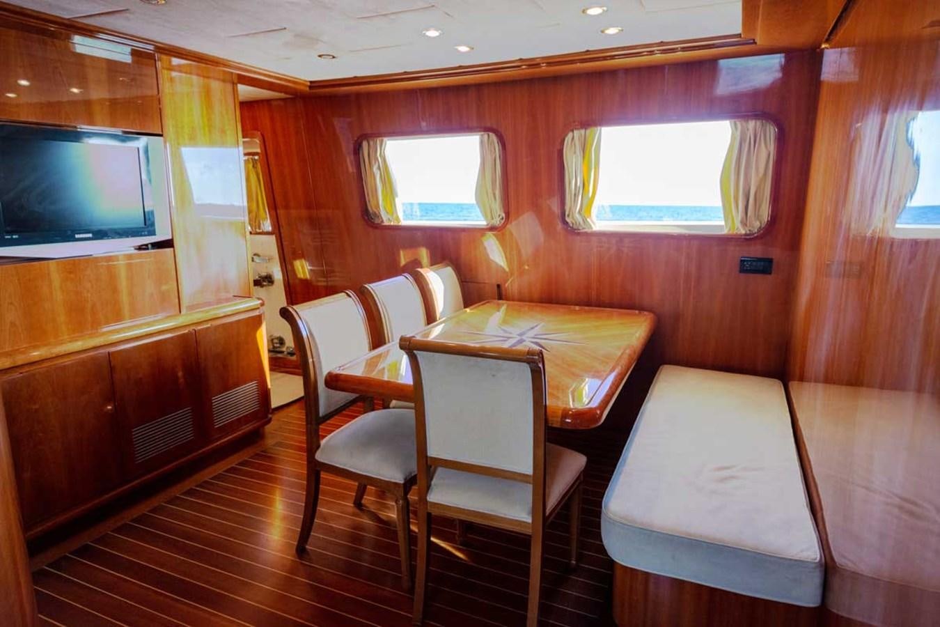 a room with a table and chairs aboard ARISTON FIVE Yacht for Sale