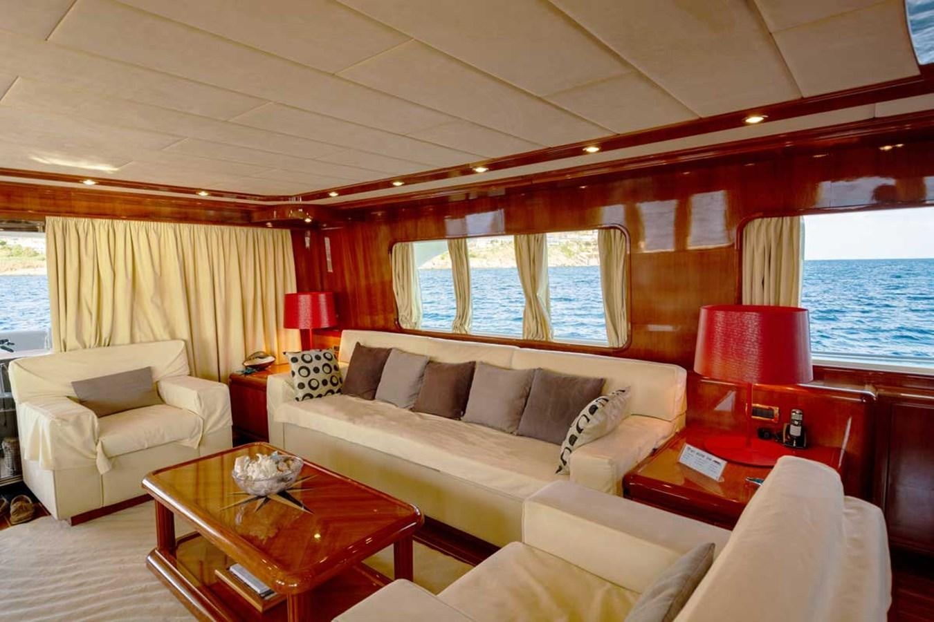 a living room with a couch and a table aboard ARISTON FIVE Yacht for Sale