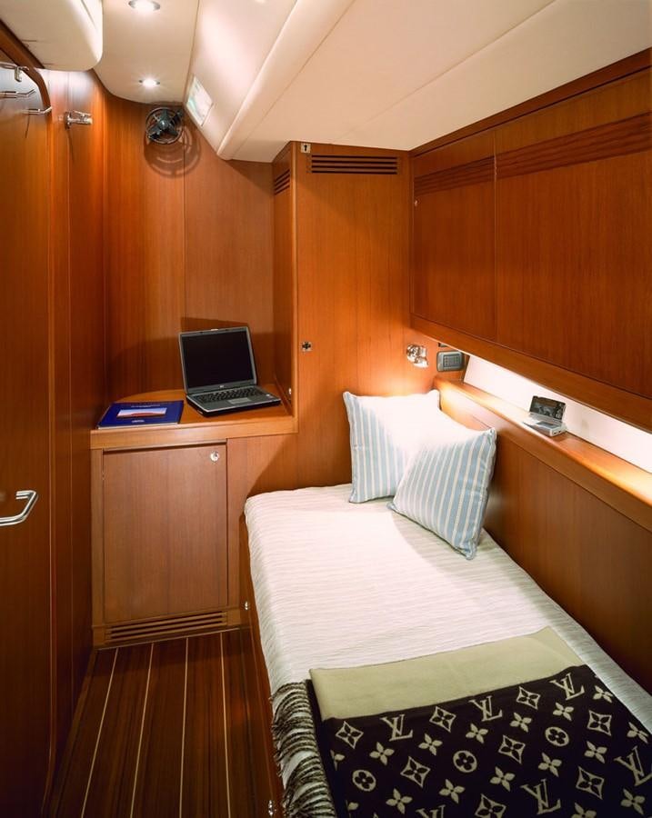 a laptop on a desk aboard OCEAN HORSE Yacht for Sale