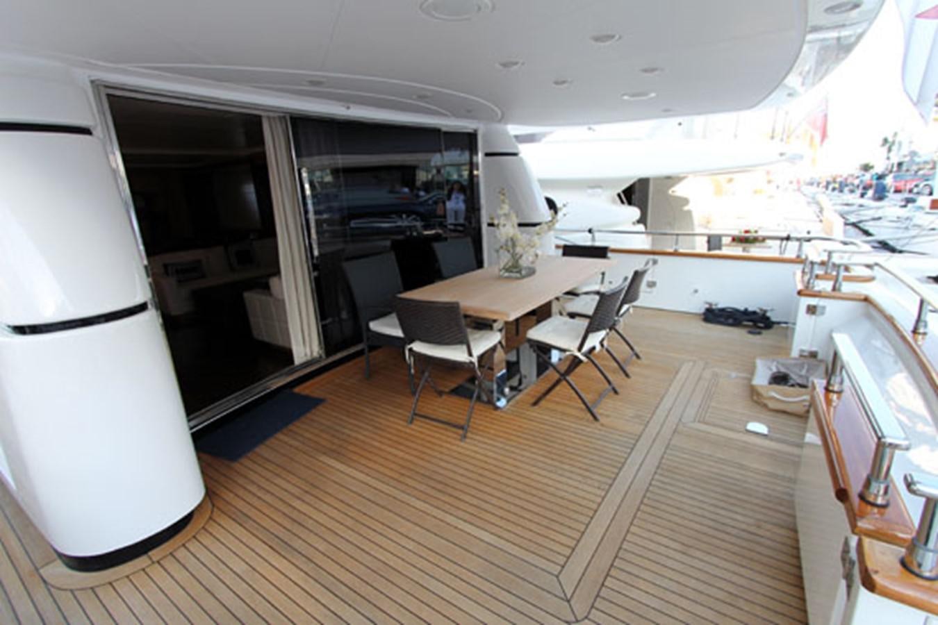a room with a table and chairs aboard JAD Yacht for Sale