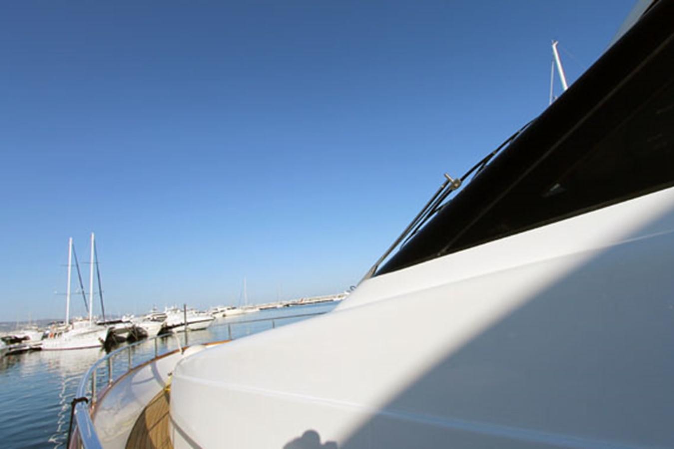 a boat docked at a pier aboard JAD Yacht for Sale