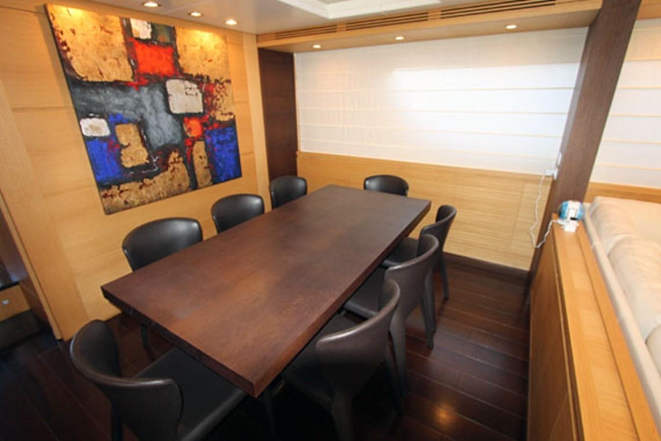 a table with chairs around it aboard JAD Yacht for Sale