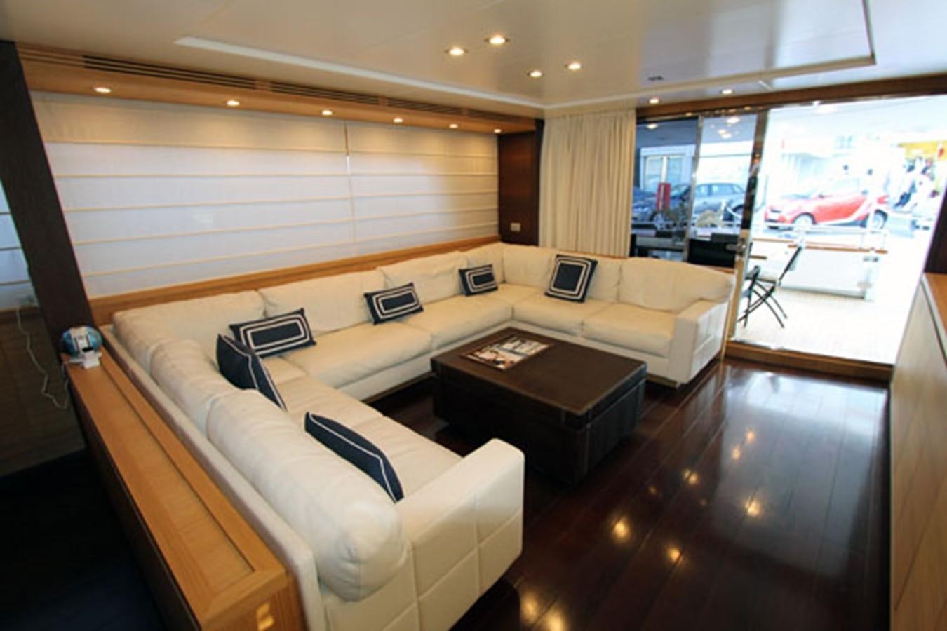 a living room with a large window aboard JAD Yacht for Sale