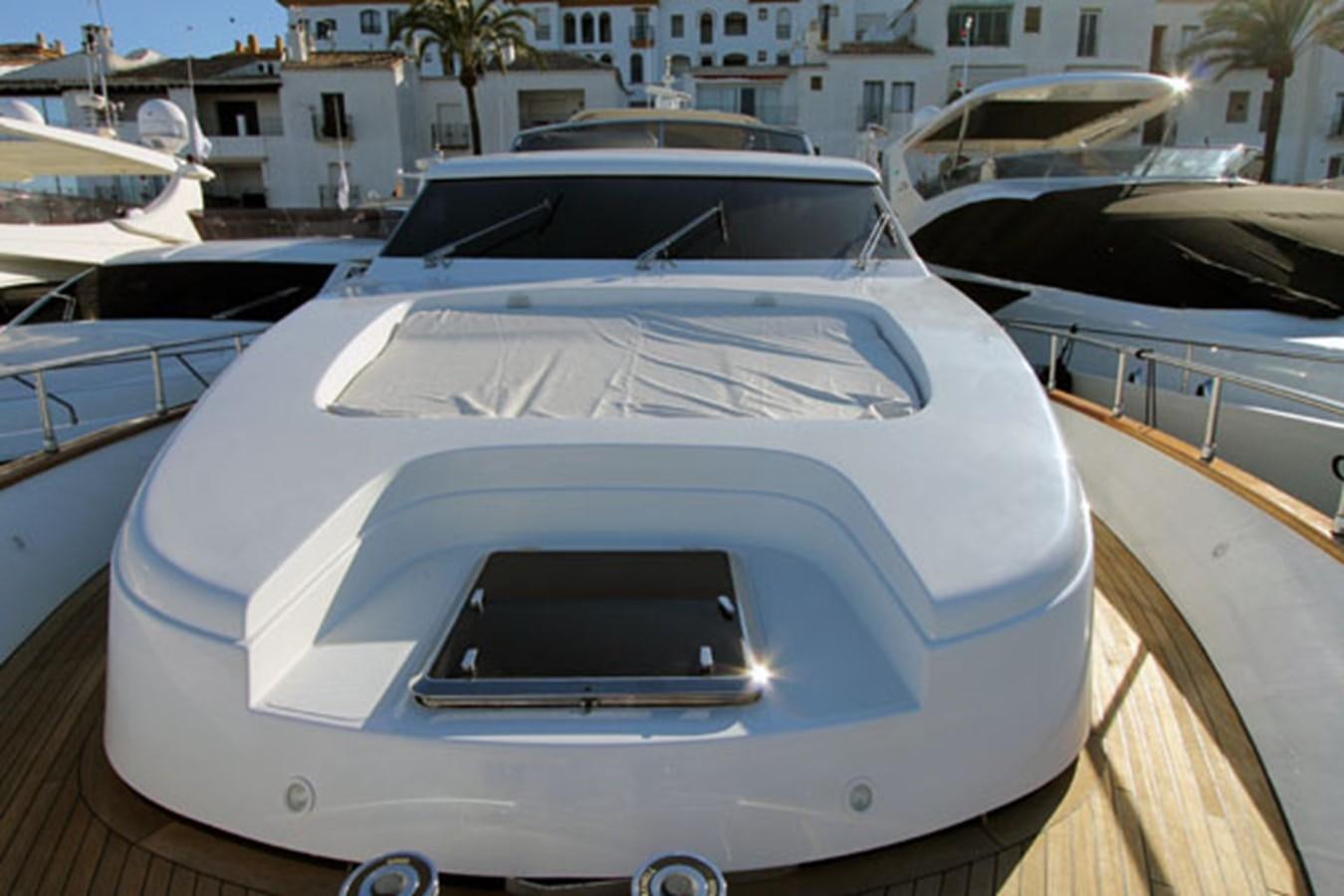 a white car parked on a dock aboard JAD Yacht for Sale