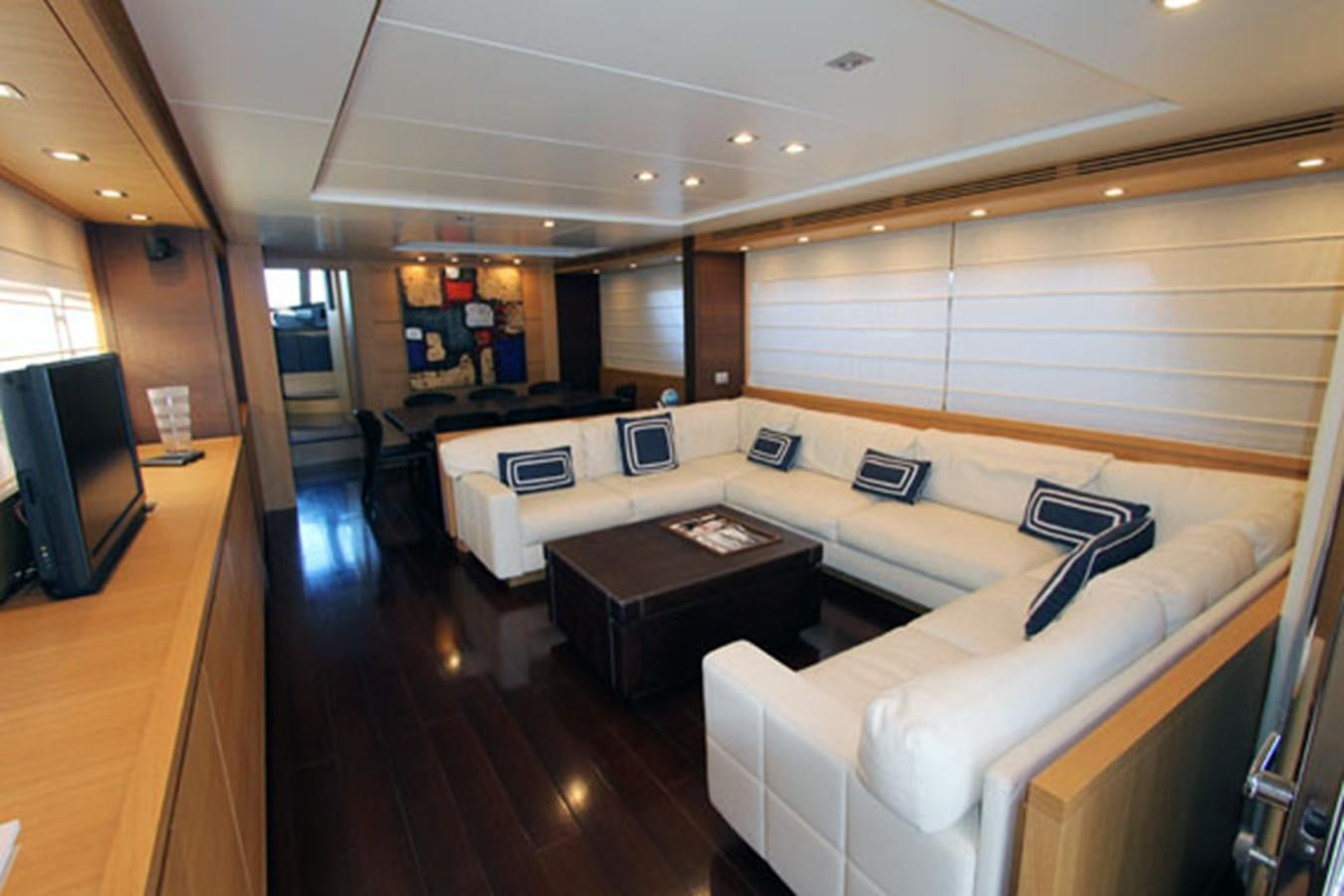 a room with a couch and a television aboard JAD Yacht for Sale