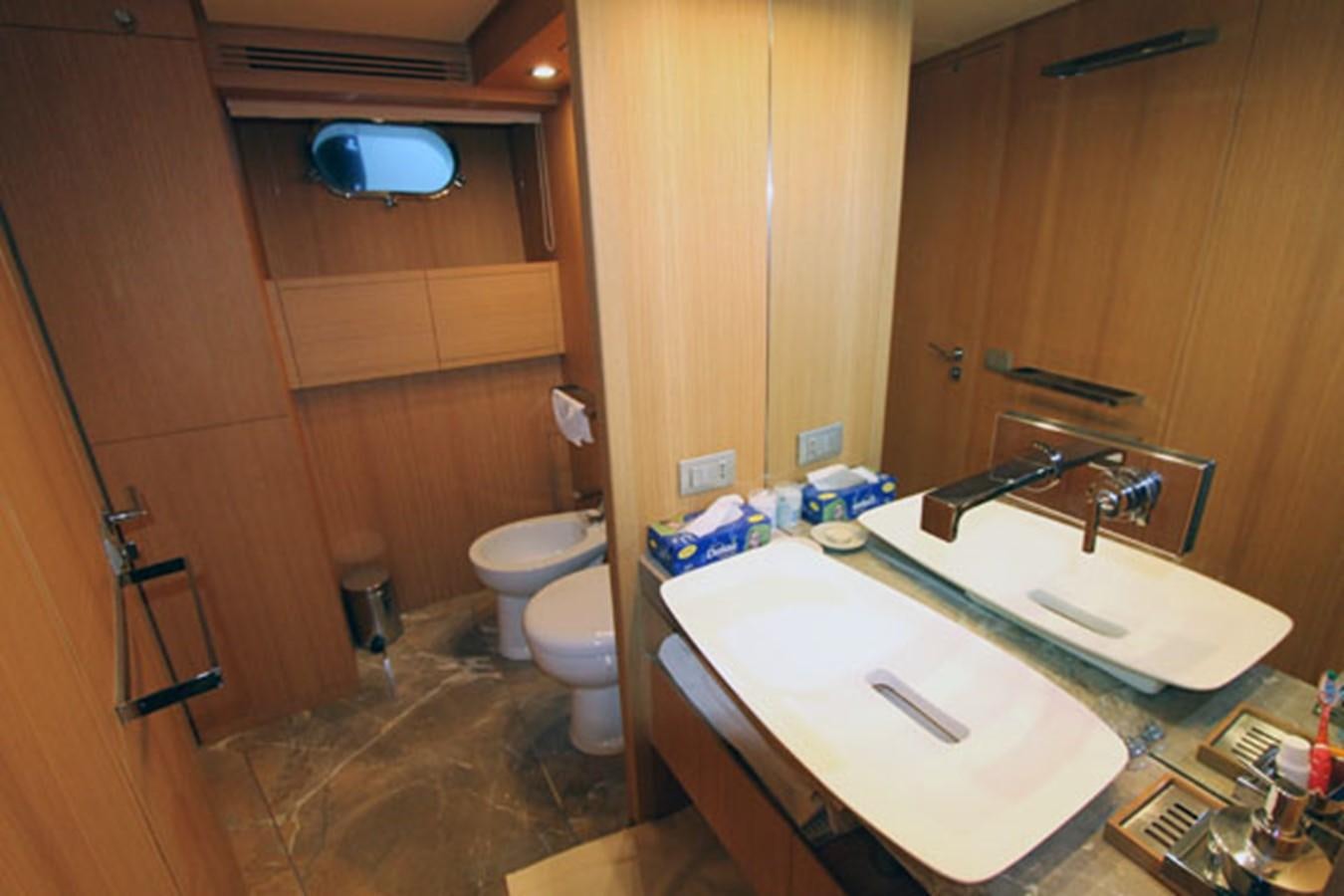 a bathroom with a sink and toilet aboard JAD Yacht for Sale
