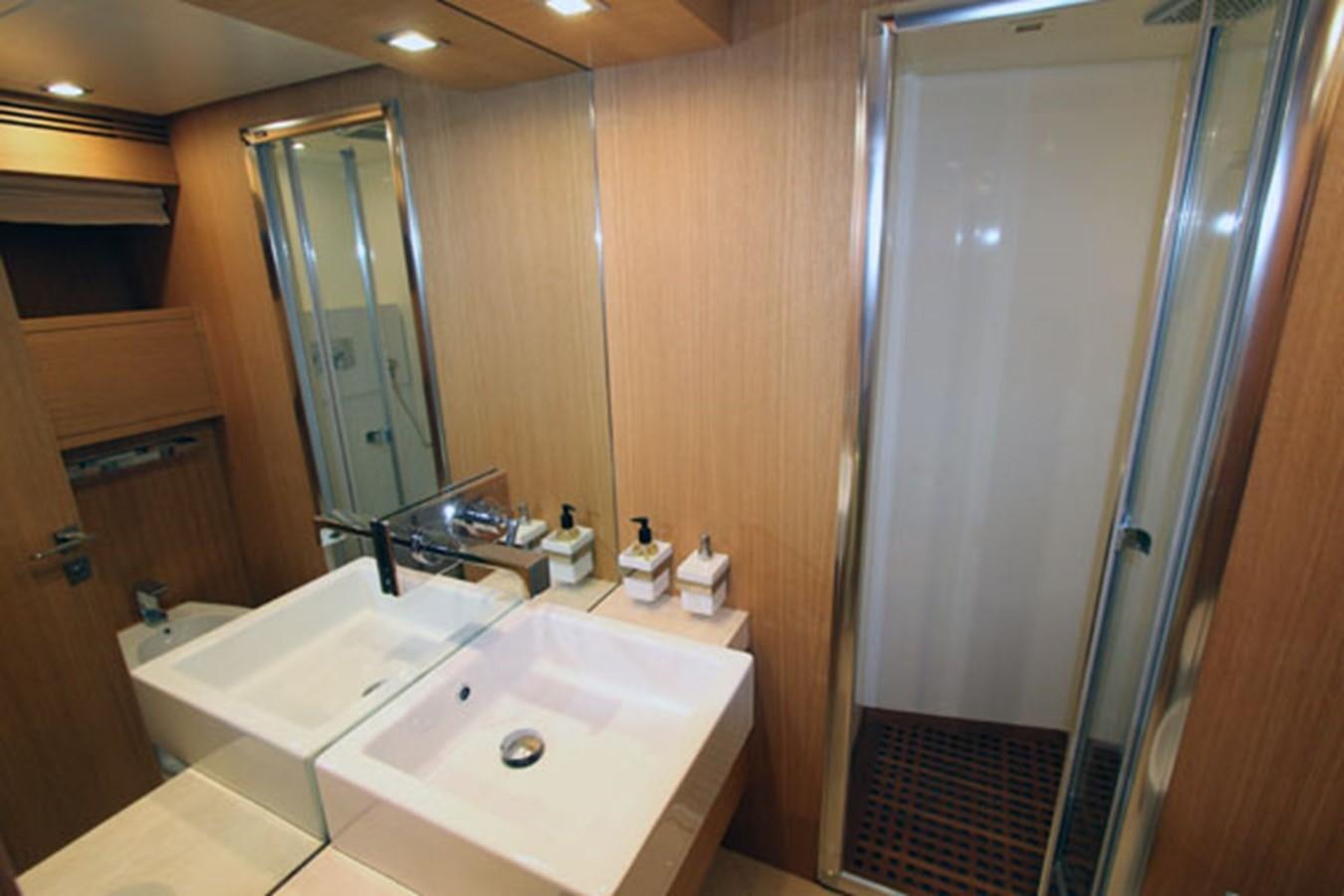 a bathroom with a sink and a mirror aboard JAD Yacht for Sale