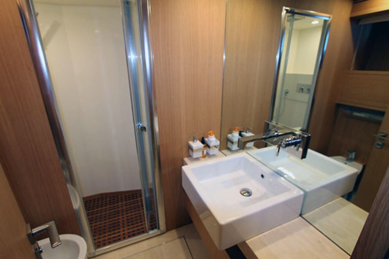 a bathroom with a sink and a mirror aboard JAD Yacht for Sale