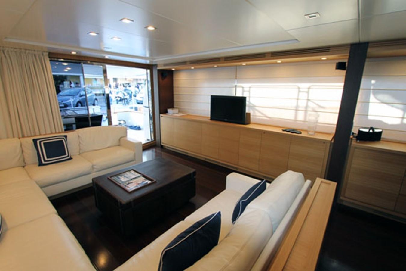 a room with a couch and a tv aboard JAD Yacht for Sale