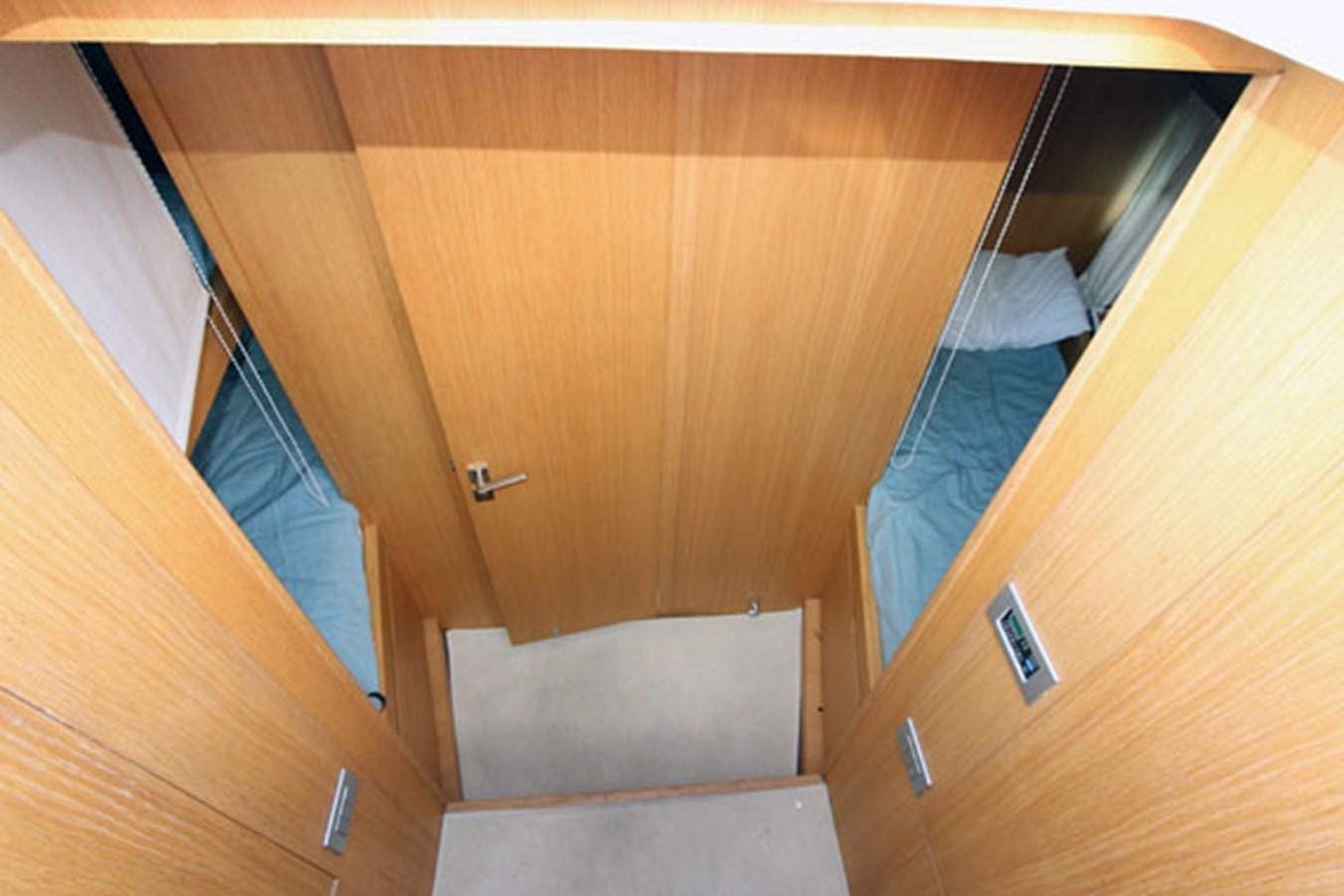 a closet with a blue towel on it aboard JAD Yacht for Sale