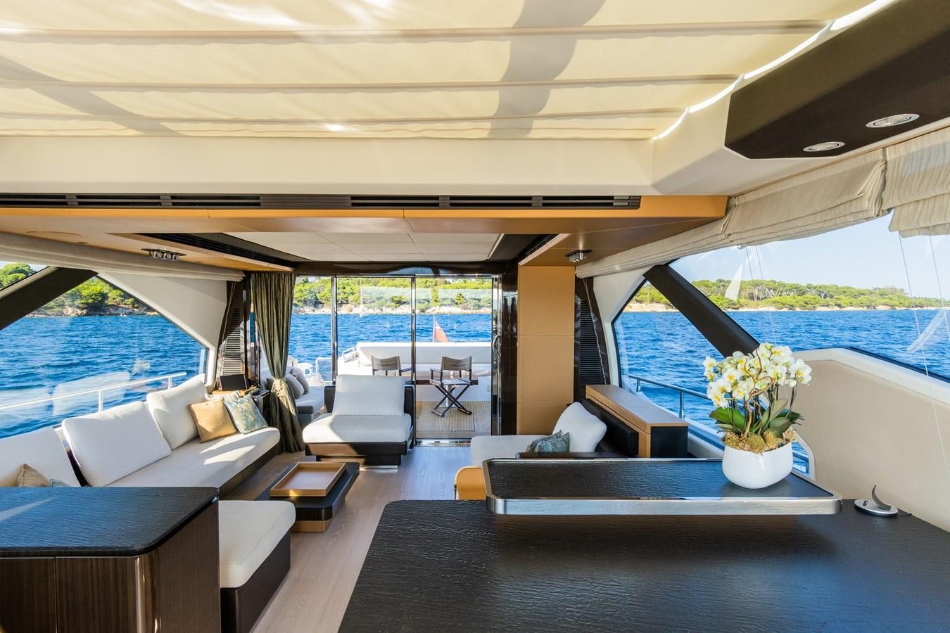 a room with a table and chairs aboard YACHTI ANA Yacht for Sale