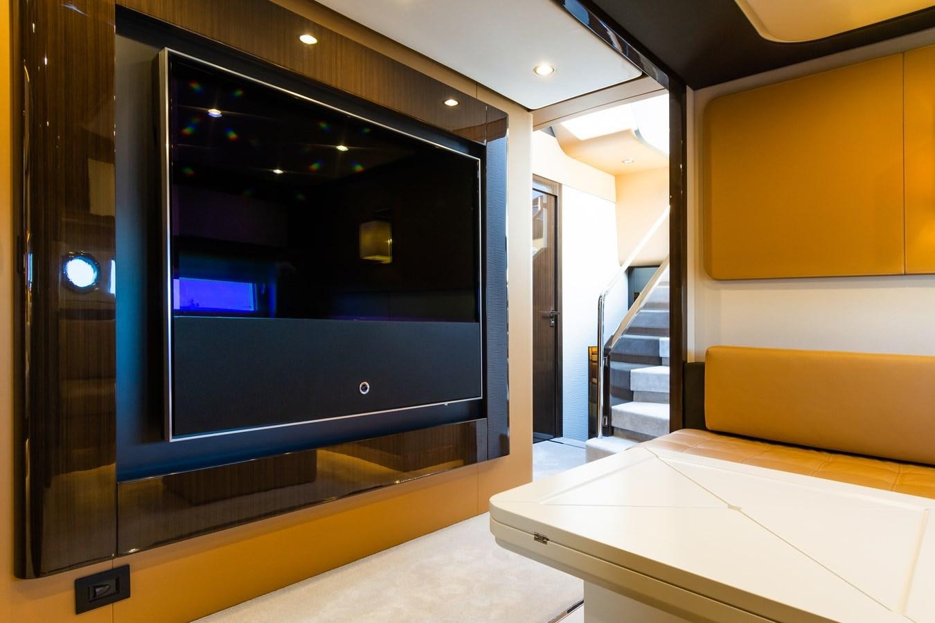 a large black screen in a room aboard YACHTI ANA Yacht for Sale