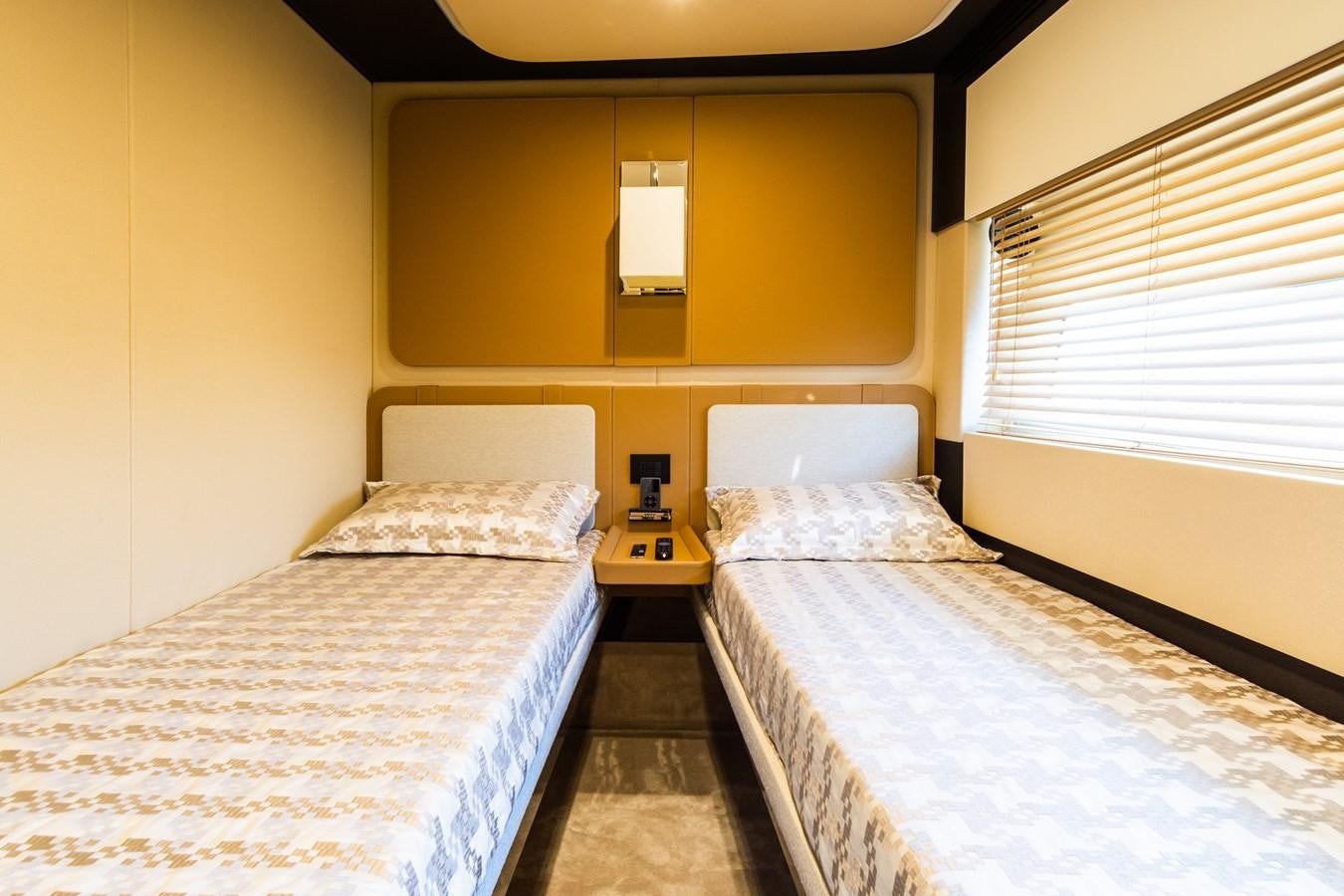 a couple of beds in a hotel room aboard YACHTI ANA Yacht for Sale