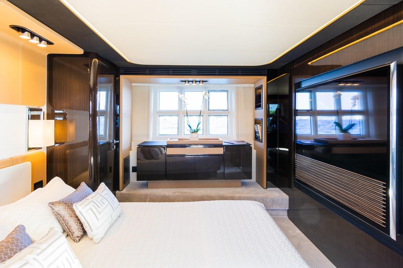 a room with a bed and a large window aboard YACHTI ANA Yacht for Sale