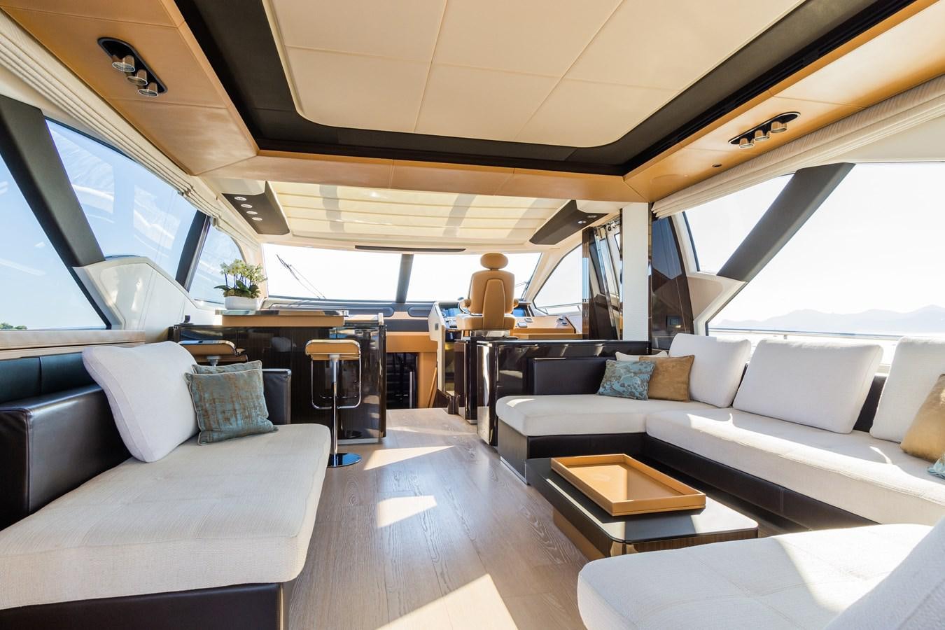 a room with couches and a table aboard YACHTI ANA Yacht for Sale
