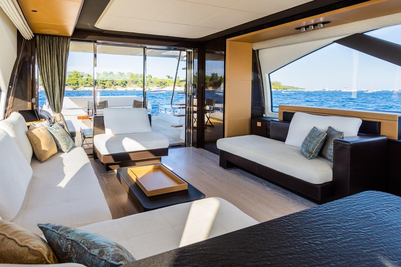 a living room with a large window aboard YACHTI ANA Yacht for Sale