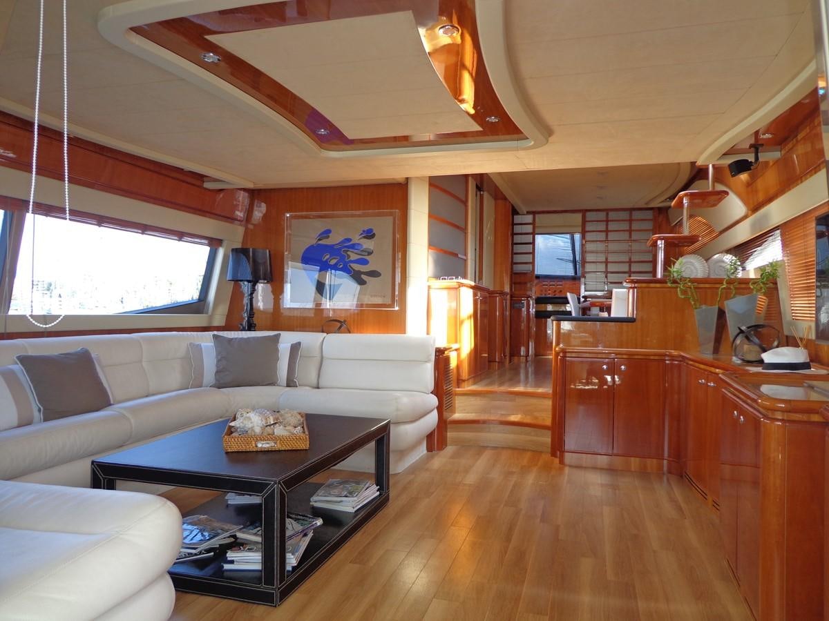 a living room with a wood floor aboard FERRETTI 760 Yacht for Sale