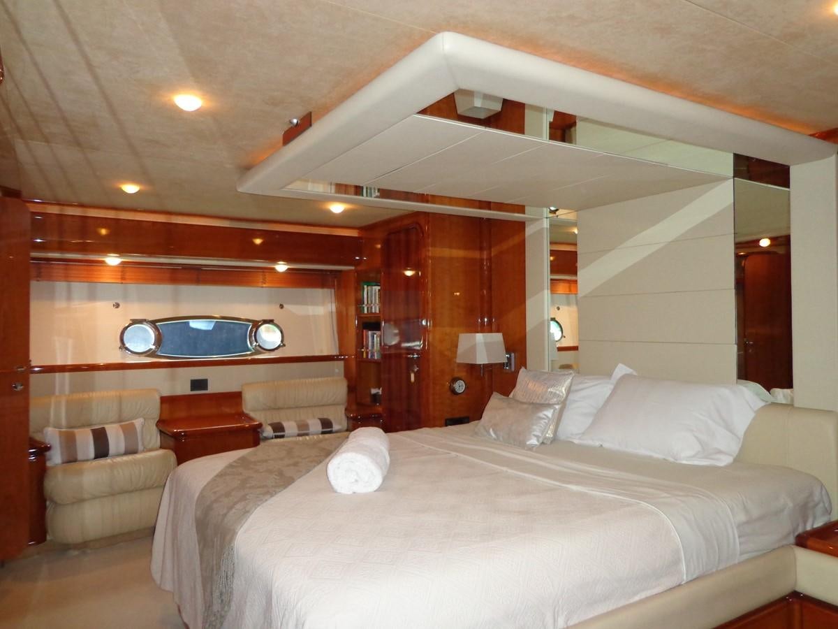 a large hotel room with a large bed and a large mirror aboard FERRETTI 760 Yacht for Sale