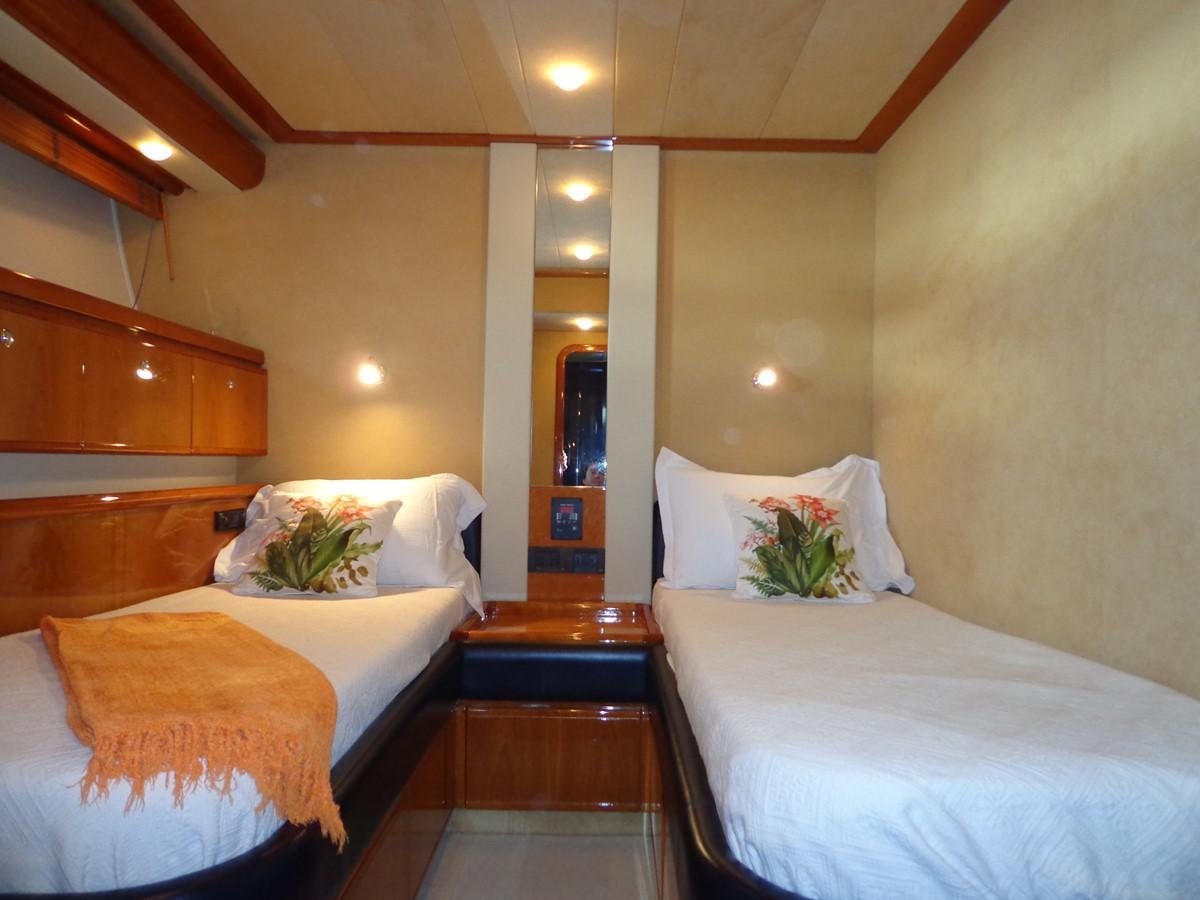 a room with two beds aboard FERRETTI 760 Yacht for Sale