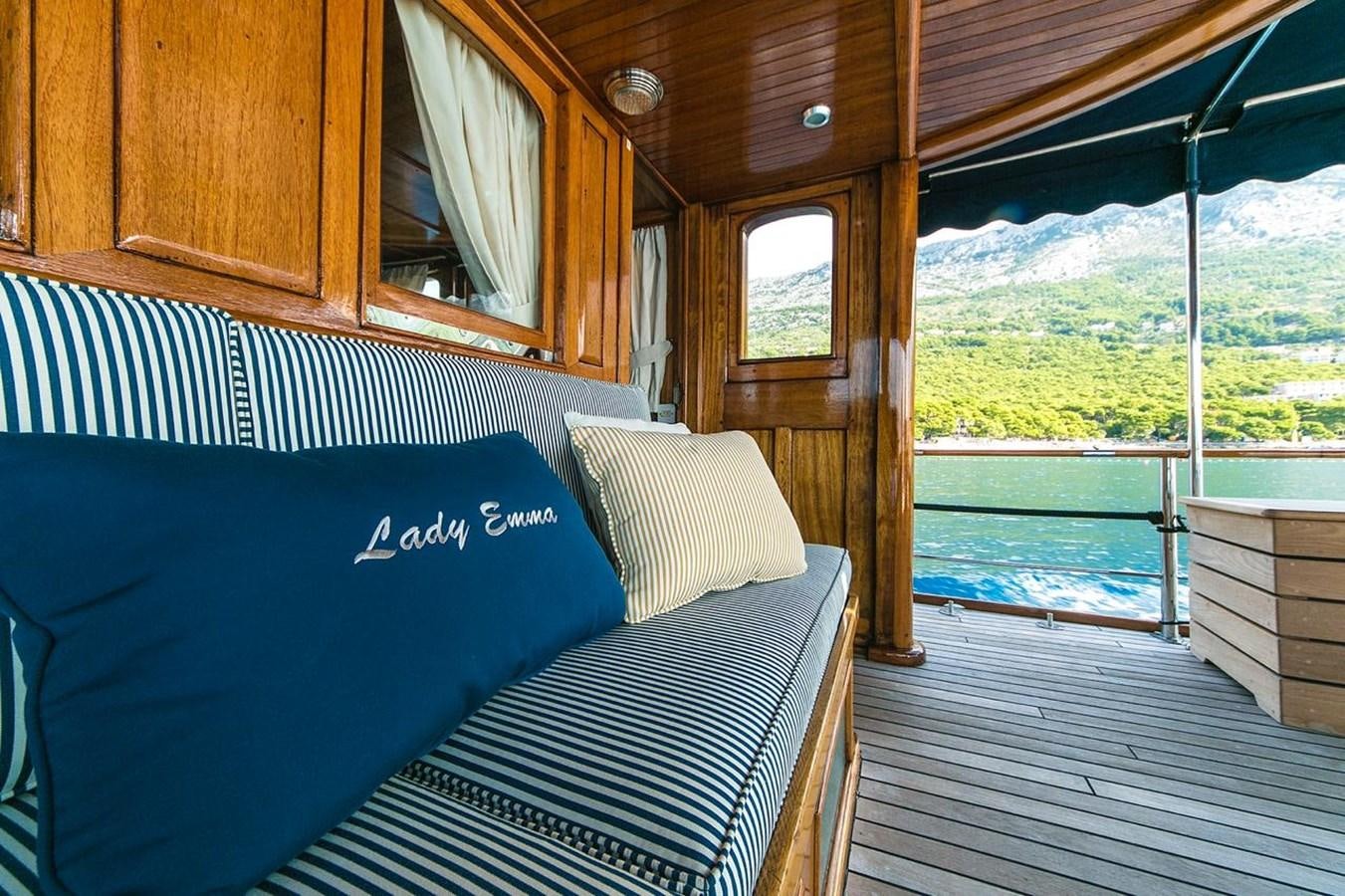 a cabin with a bed and a view of the lake aboard LADY EMMA Yacht for Sale