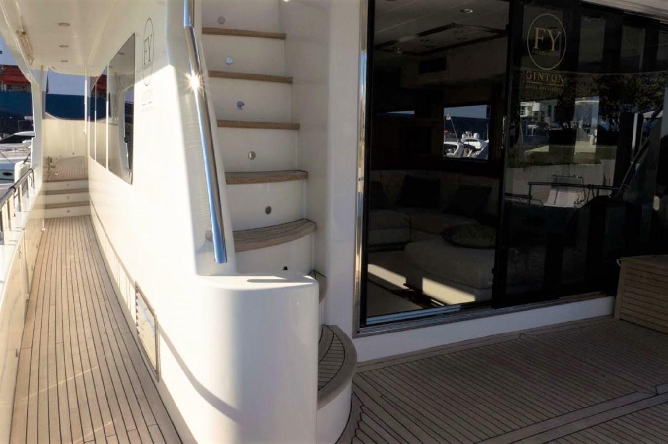 a room with a wood floor and a door with a wood railing aboard MY WAY Yacht for Sale