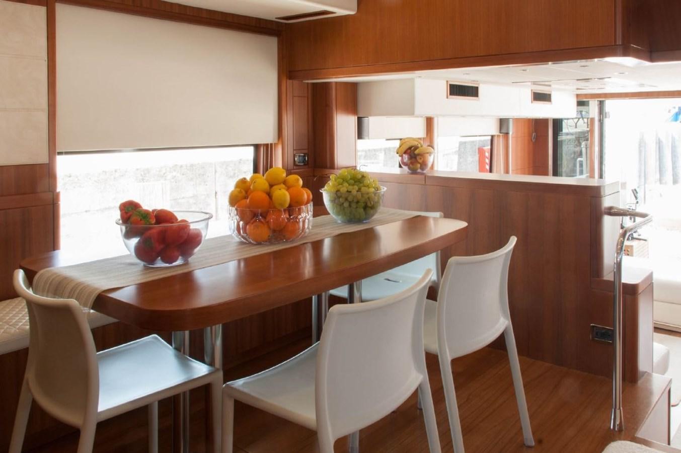 a table with chairs and fruit on it aboard MY WAY Yacht for Sale