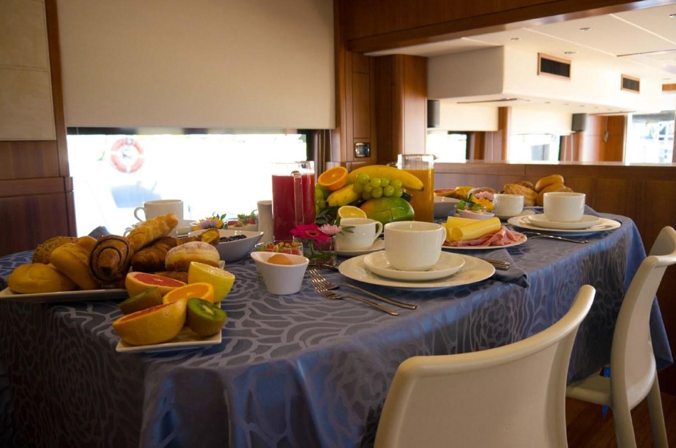 a table with food on it aboard MY WAY Yacht for Sale