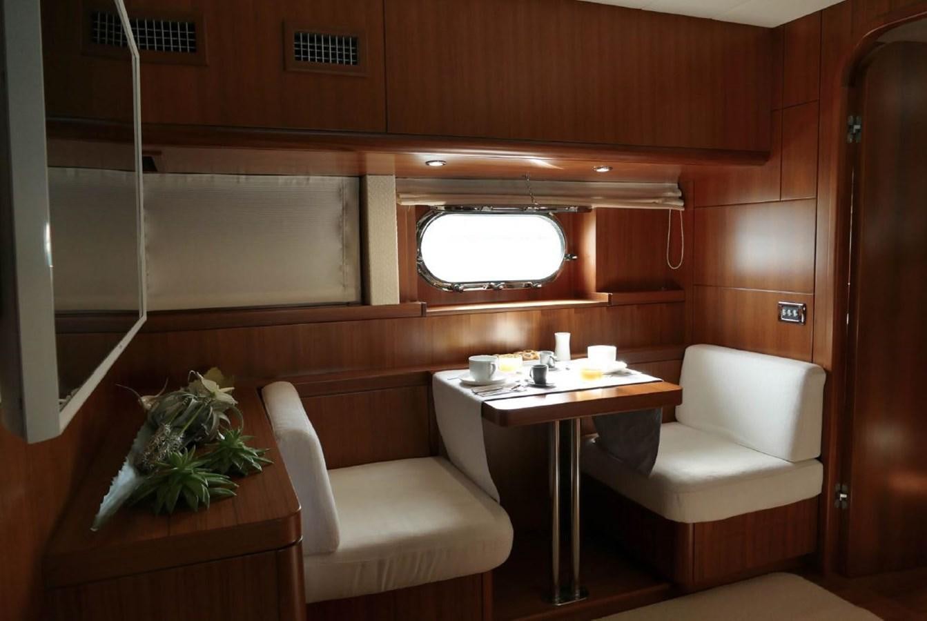 a room with a table and chairs aboard MY WAY Yacht for Sale