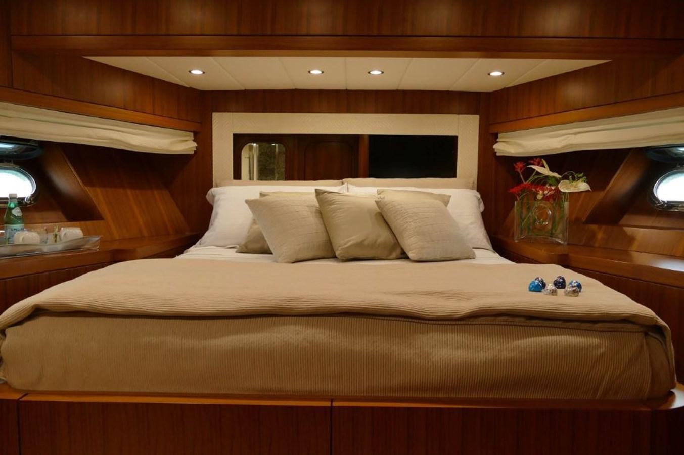 a bed with white sheets and pillows aboard MY WAY Yacht for Sale