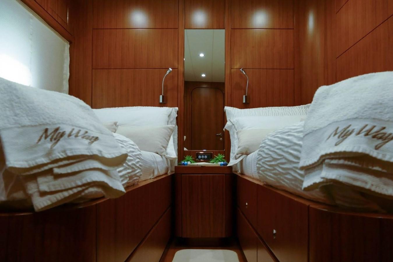 a room with a bed and a mirror aboard MY WAY Yacht for Sale