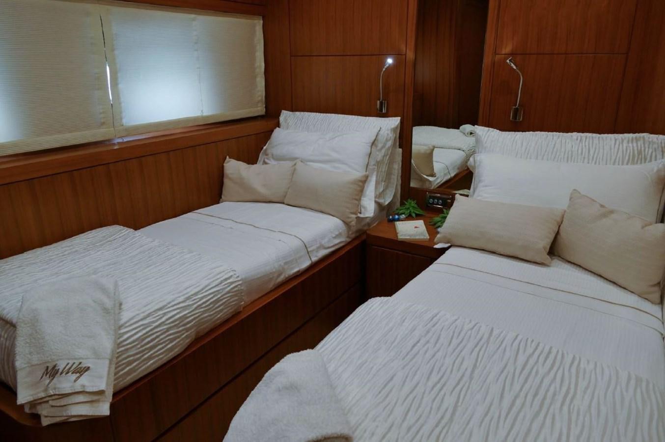 a room with beds and a window aboard MY WAY Yacht for Sale
