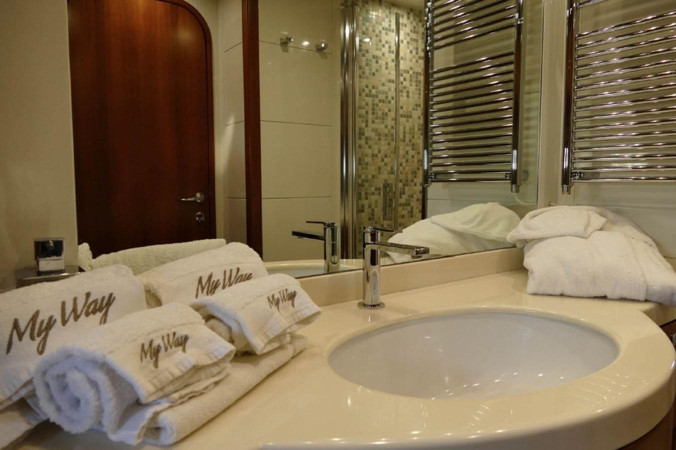 a bathroom with a sink and mirror aboard MY WAY Yacht for Sale