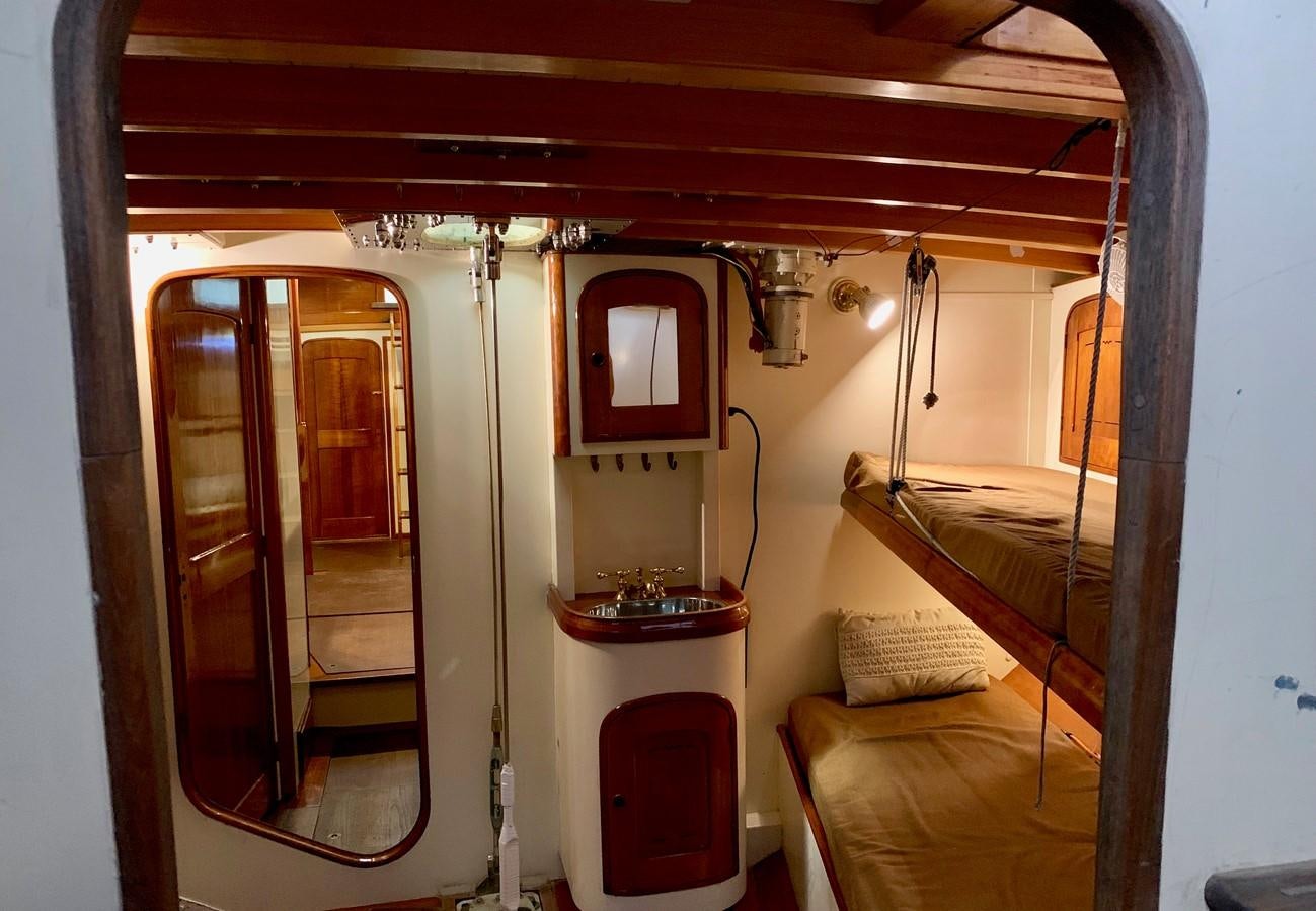 a small cabin with a bunk bed aboard WILD HORSES Yacht for Sale