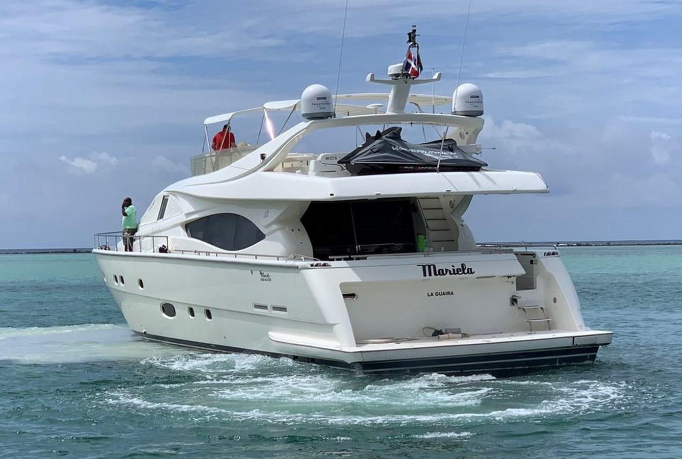 a white boat in the water aboard MARIELA Yacht for Sale