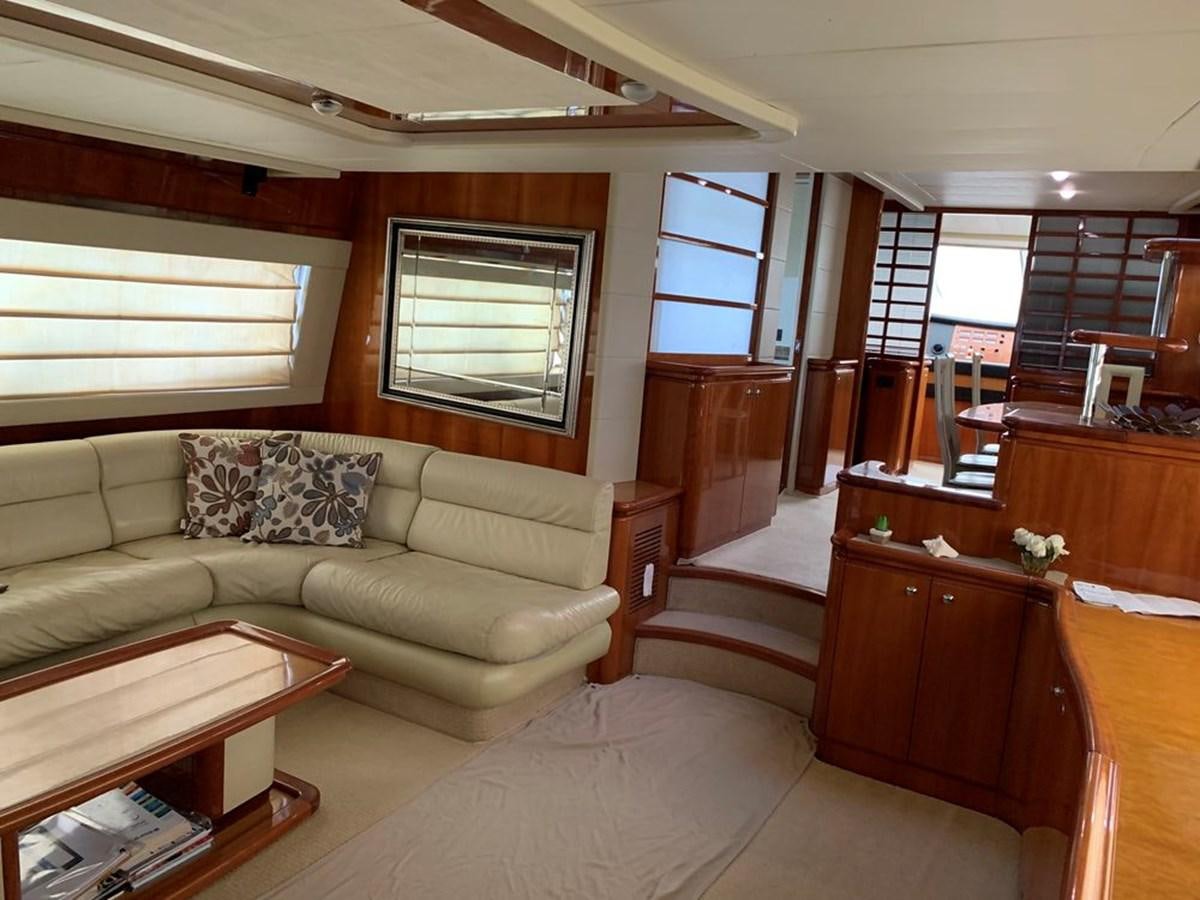 a living room with a couch and a table aboard MARIELA Yacht for Sale