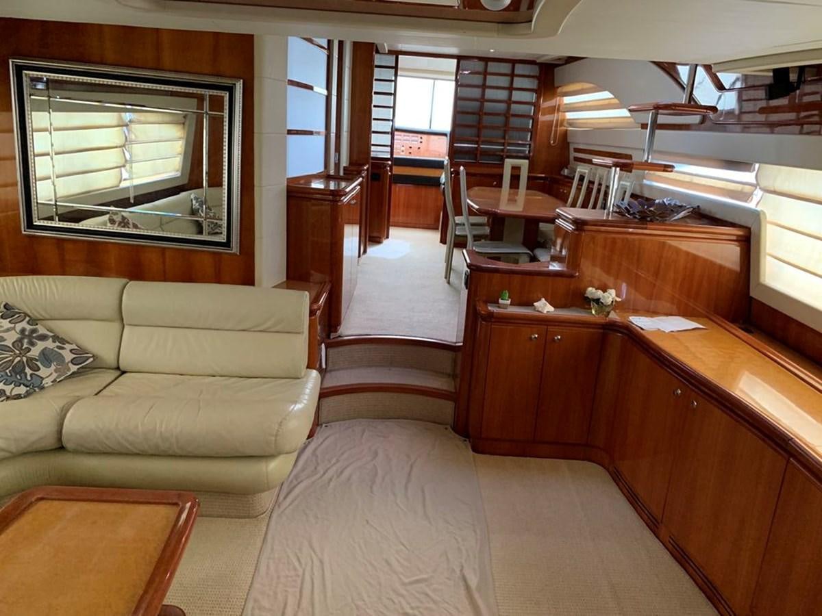 a living room with a couch and a table aboard MARIELA Yacht for Sale