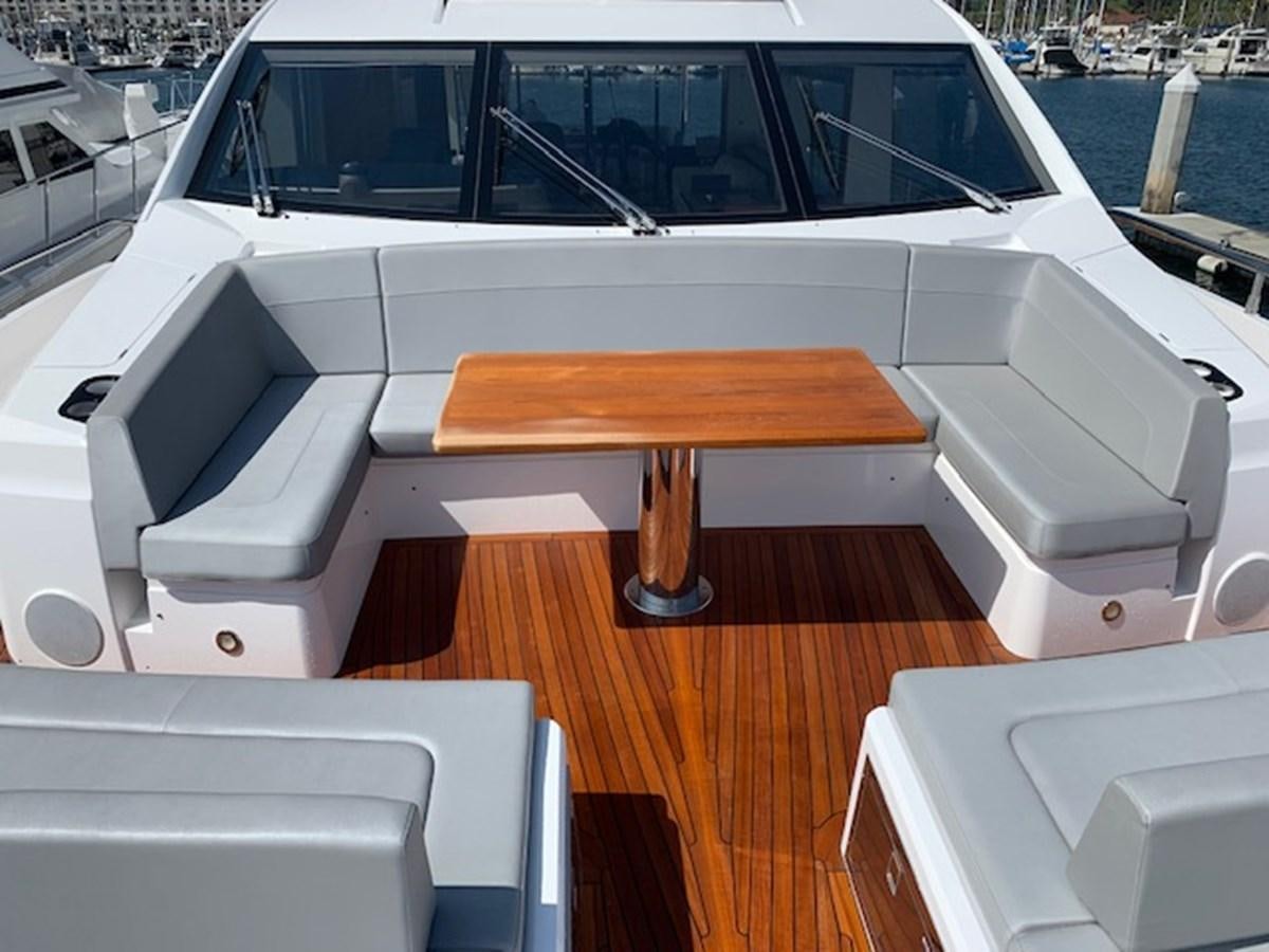 a white boat on a deck aboard SEA SCAPE Yacht for Sale