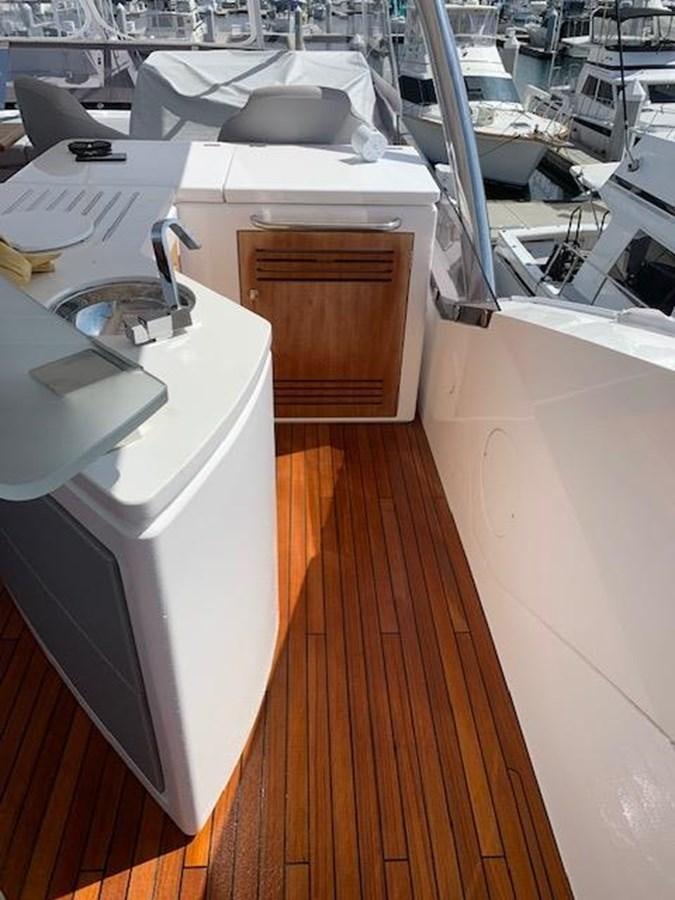 a room with a table and chairs aboard SEA SCAPE Yacht for Sale
