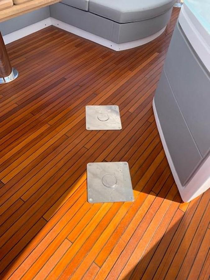 a white object on a wooden surface aboard SEA SCAPE Yacht for Sale