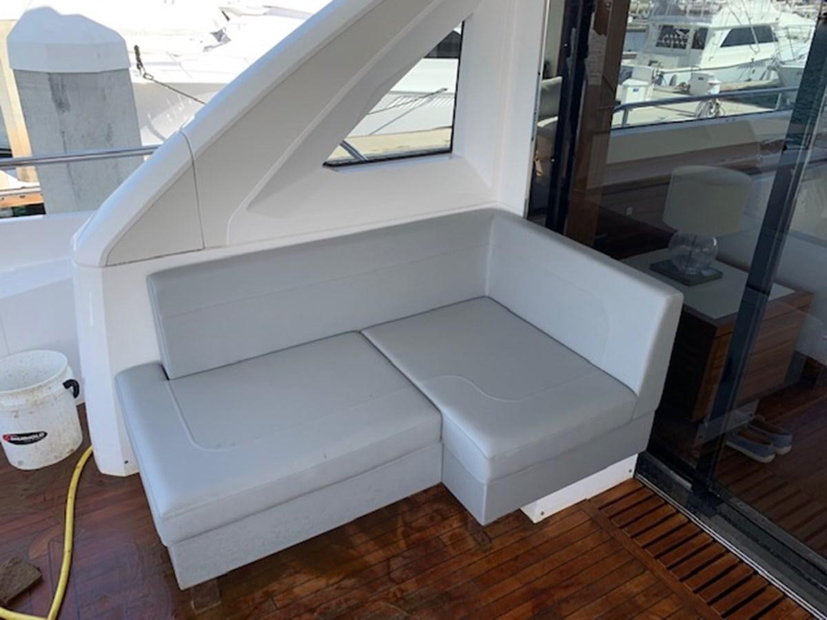 a white couch in a room aboard SEA SCAPE Yacht for Sale