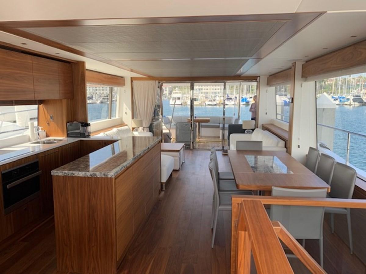 a large kitchen with a large window aboard SEA SCAPE Yacht for Sale