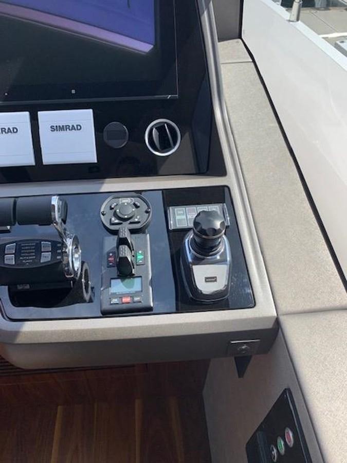 a close-up of a car stereo aboard SEA SCAPE Yacht for Sale