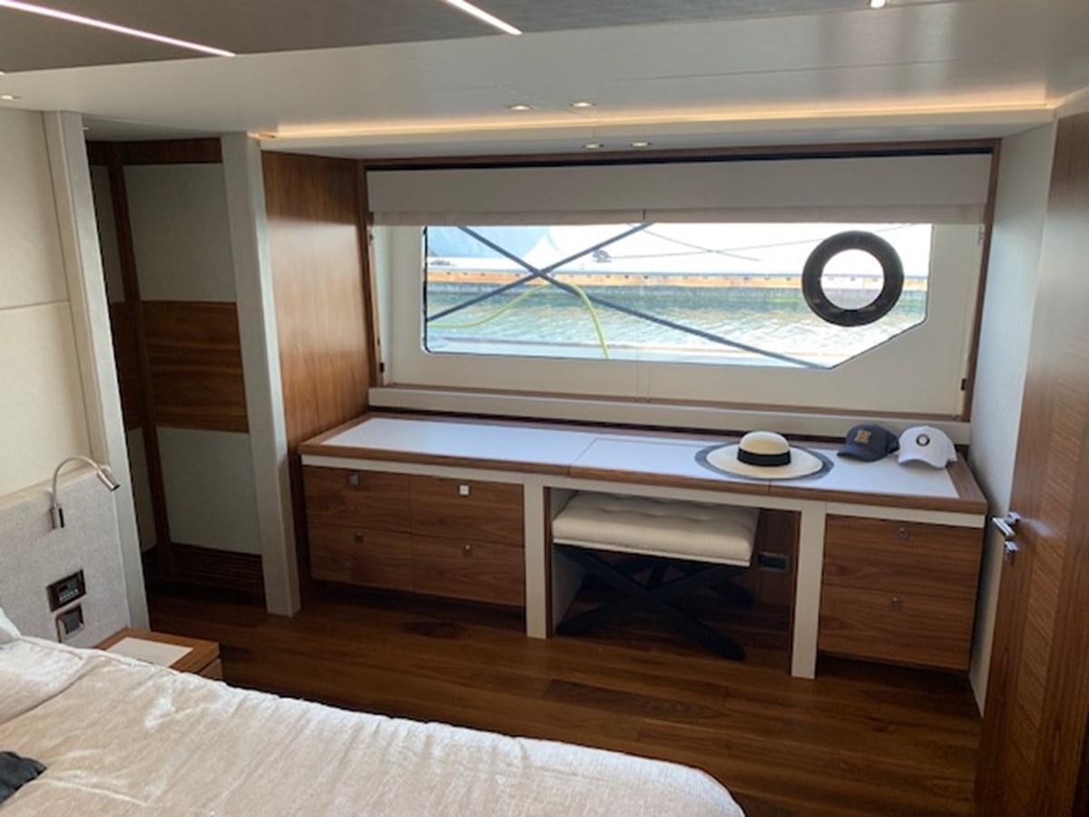 a room with a bed and a window aboard SEA SCAPE Yacht for Sale