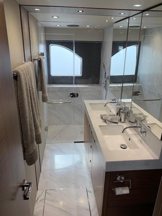 a bathroom with a sink and a mirror aboard SEA SCAPE Yacht for Sale