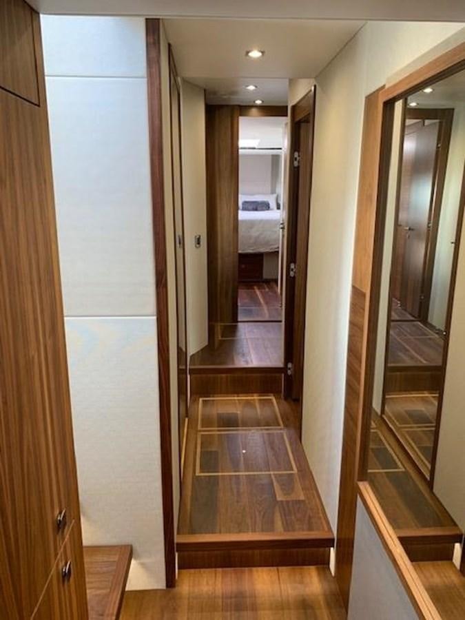 a hallway with a glass door aboard SEA SCAPE Yacht for Sale