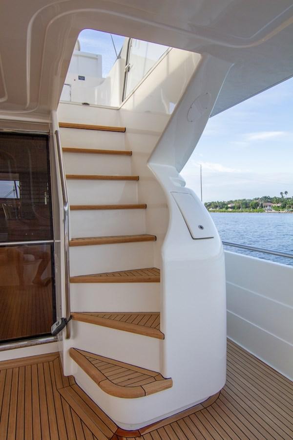 a white boat with a wooden frame aboard SEA PAL Yacht for Sale