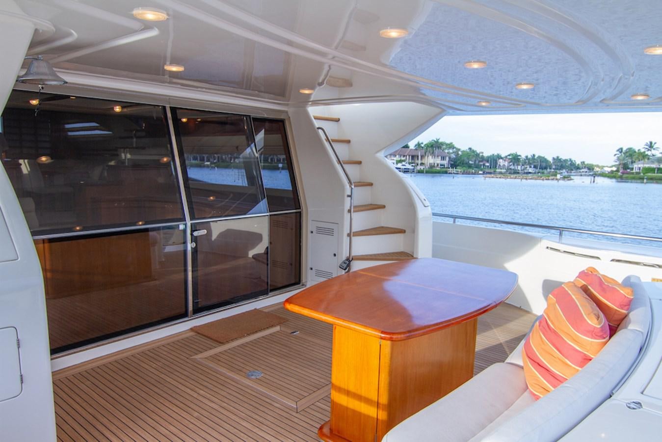 a room with a table and chairs aboard SEA PAL Yacht for Sale