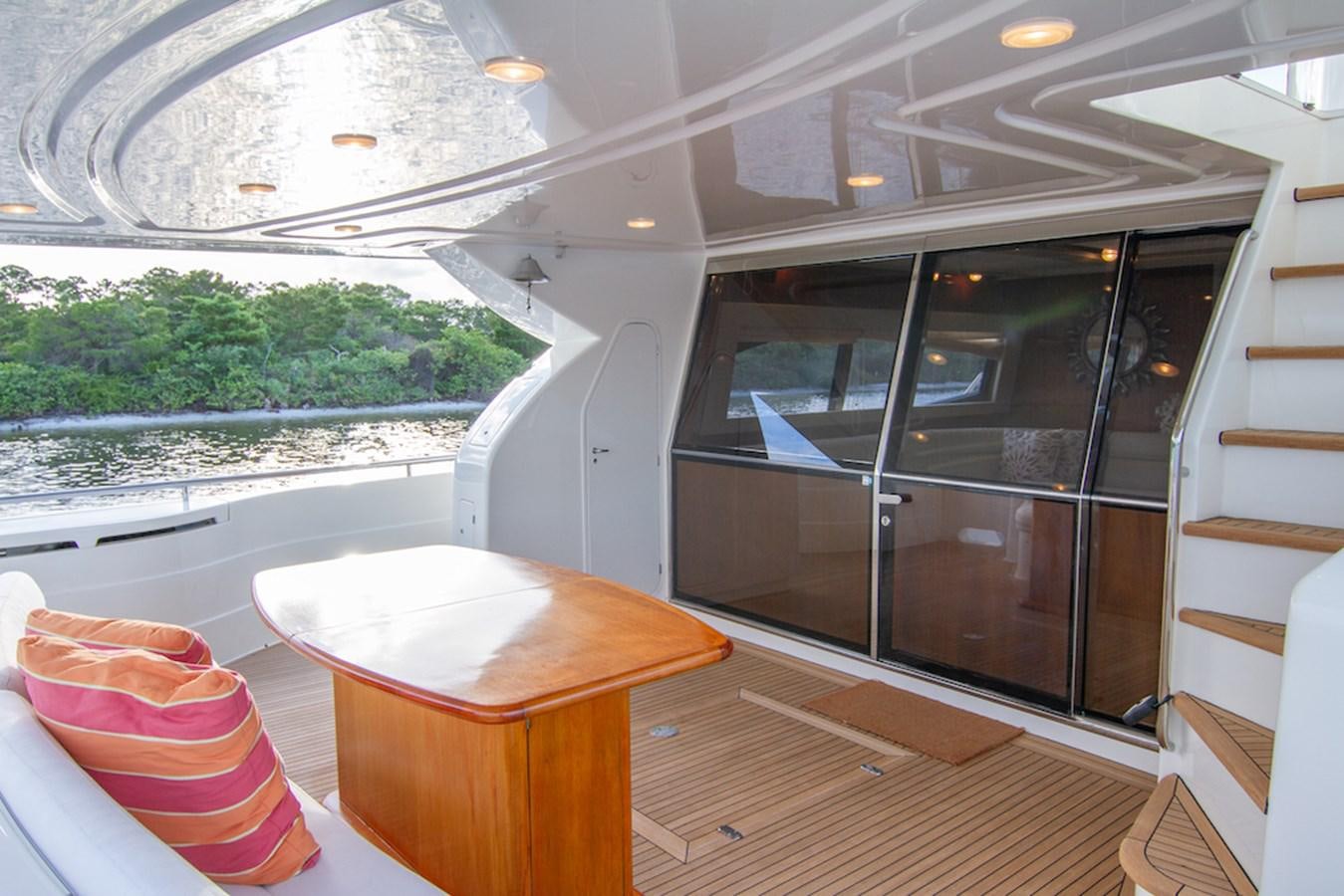 a room with a table and chairs aboard SEA PAL Yacht for Sale