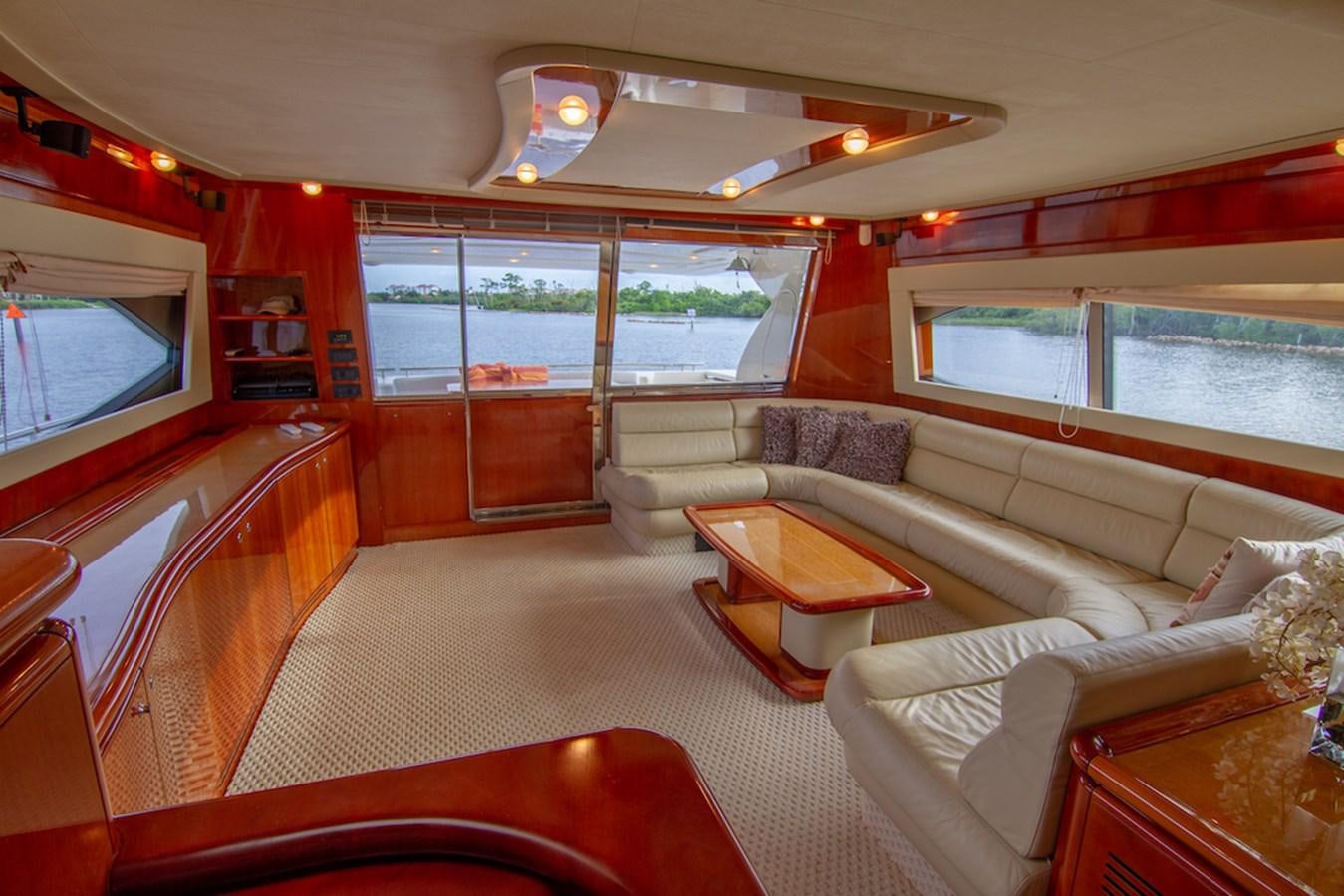 a living room with a large window aboard SEA PAL Yacht for Sale