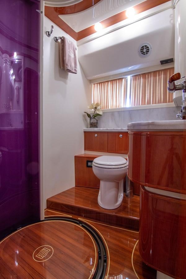 a bathroom with a sink toilet and cabinets aboard SEA PAL Yacht for Sale